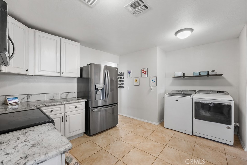 13336 Clement Edwards, CA 93523 - Photo 14 of 56 a kitchen with a sink a stove and refrigerator