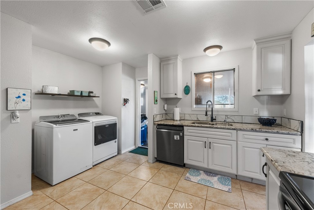 13336 Clement Edwards, CA 93523 - Photo 15 of 56 a kitchen with a stove top oven sink and cabinets