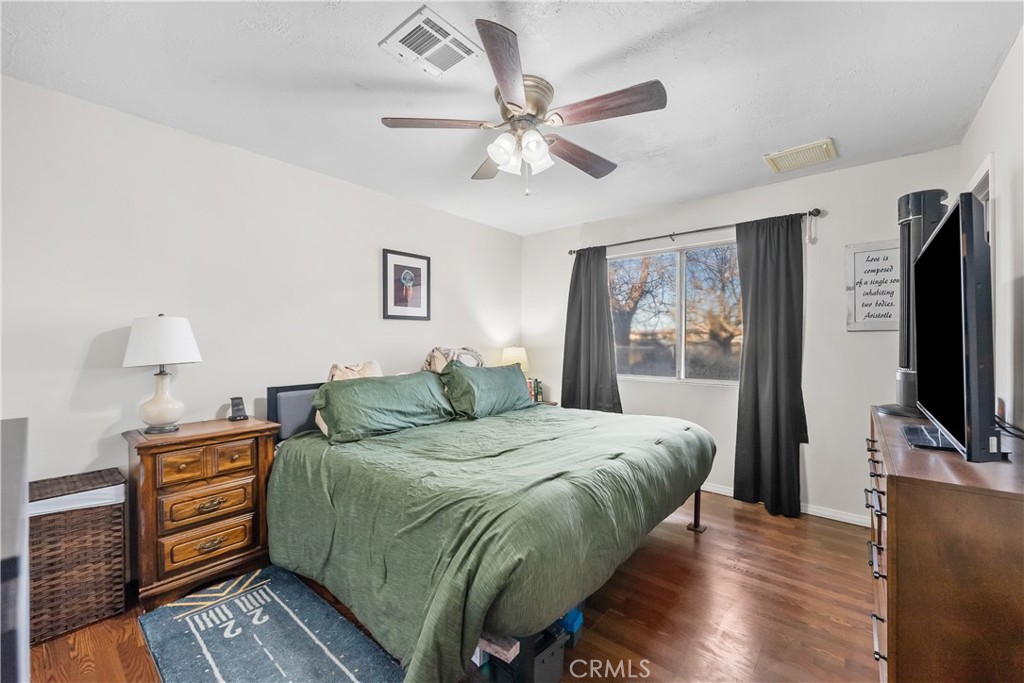 13336 Clement Edwards, CA 93523 - Photo 24 of 56 a bedroom with a bed and a flat screen tv