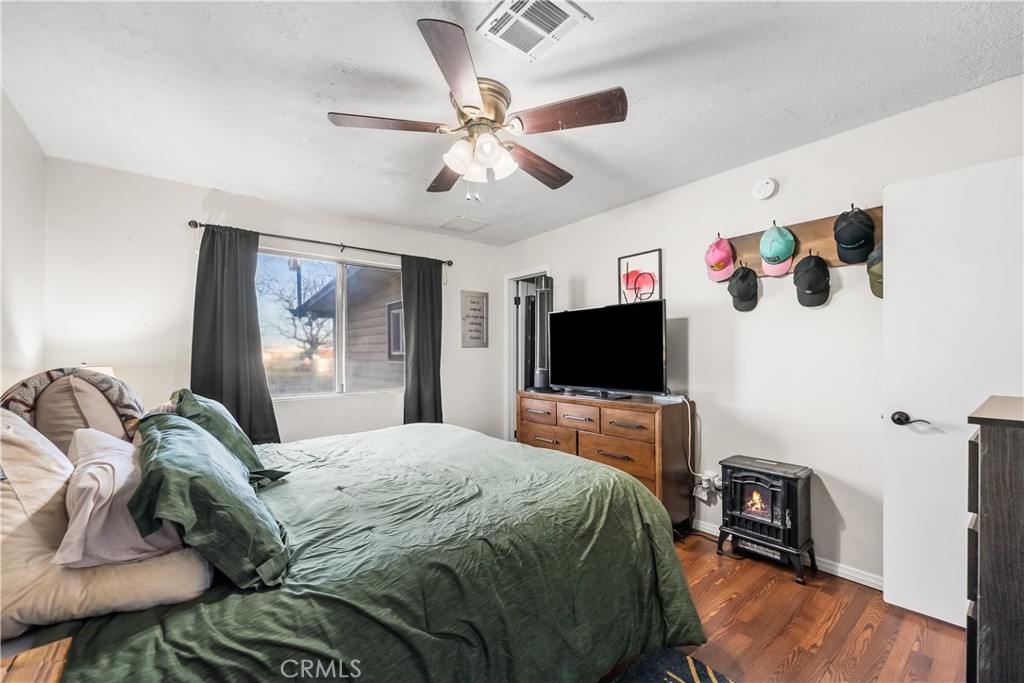 13336 Clement Edwards, CA 93523 - Photo 25 of 56 a bedroom with a bed and a flat screen tv