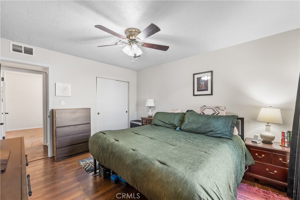 13336 Clement Edwards, CA 93523 - Photo 26 of 56 a bedroom with a bed and wooden floor