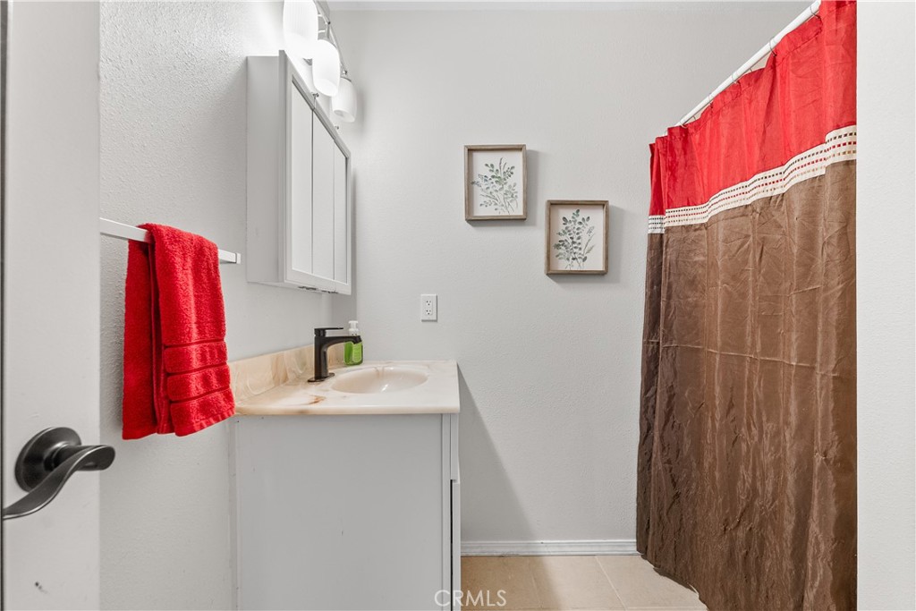 13336 Clement Edwards, CA 93523 - Photo 27 of 56 a bathroom with a sink and a mirror