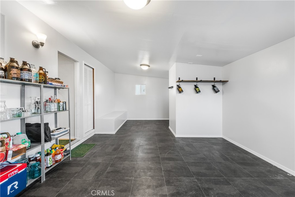 13336 Clement Edwards, CA 93523 - Photo 34 of 56 a view of a storage & utility room with clothes shoes dryer and bicycles