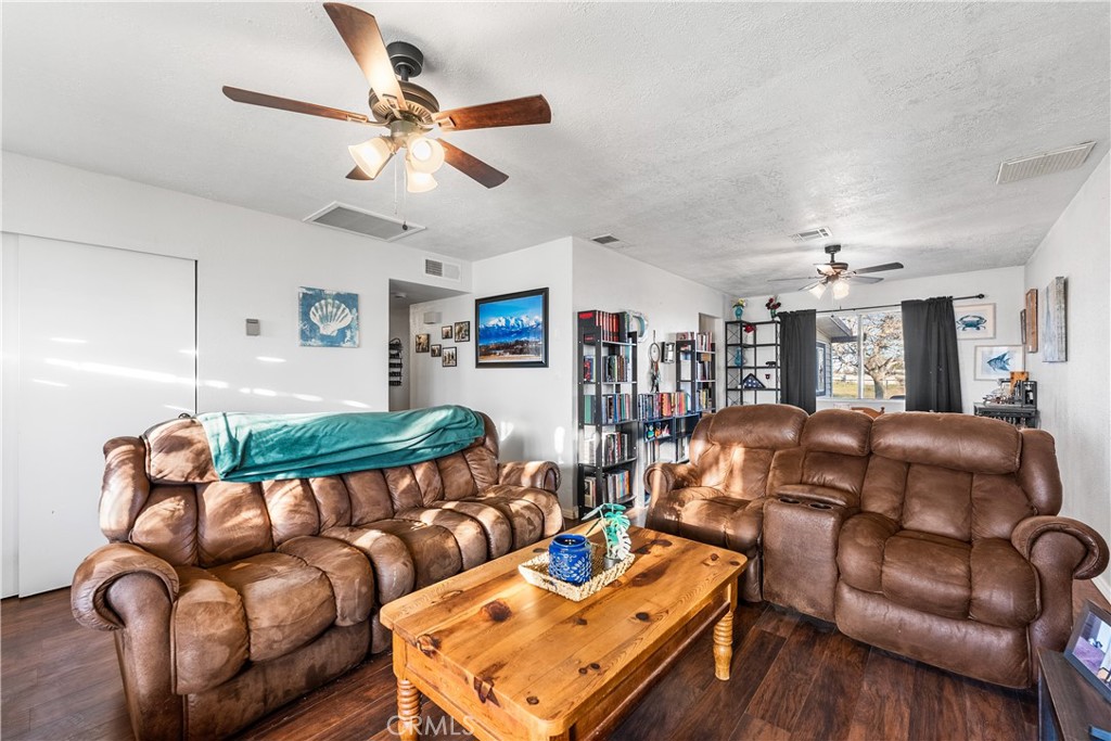 13336 Clement Edwards, CA 93523 - Photo 4 of 56 a bedroom with furniture a ceiling fan and a rug