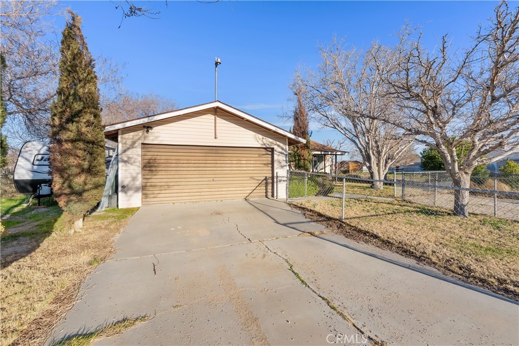 13336 Clement Edwards, CA 93523 - Photo 45 of 56 a front view of a house with a yard