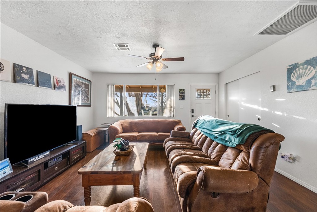 13336 Clement Edwards, CA 93523 - Photo 6 of 56 a living room with furniture and a flat screen tv