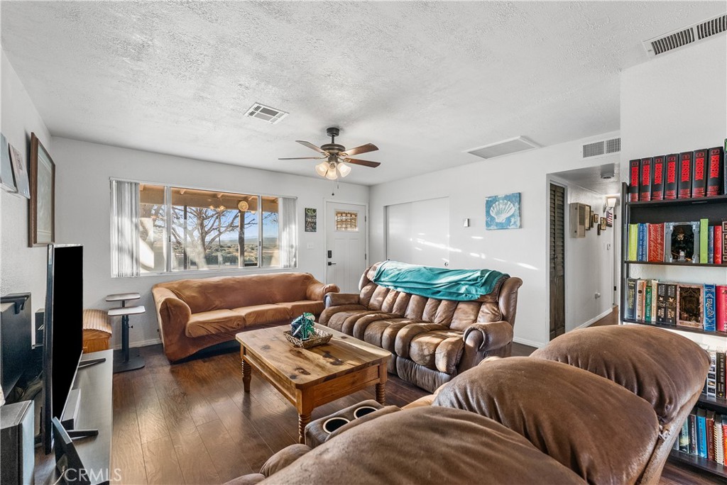 13336 Clement Edwards, CA 93523 - Photo 7 of 56 a living room with furniture and a book shelf