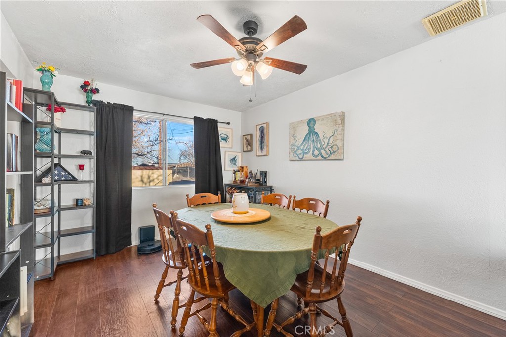 13336 Clement Edwards, CA 93523 - Photo 9 of 56 a view of a dining room with furniture and wooden floor