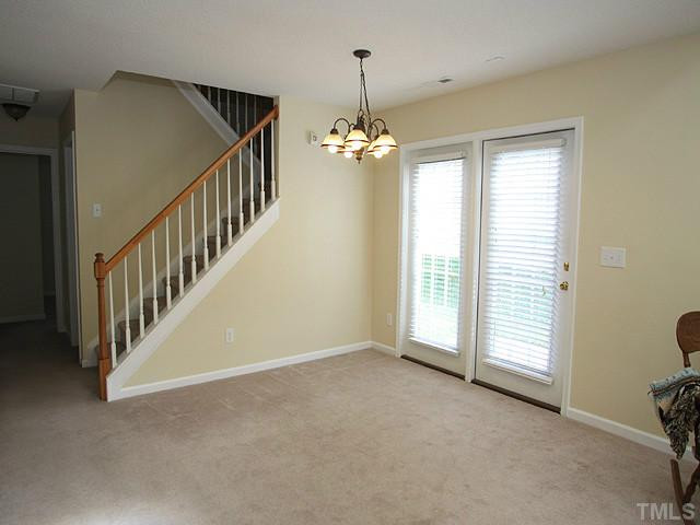 5518 Golden Moss Trail Raleigh, NC 27613 - Photo 4 of 13 a view of an empty room with a window