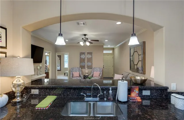 a living room with dining table and chairs