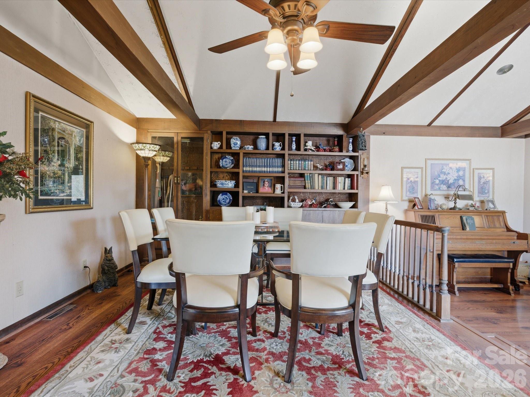 2620 Reeves Island Road Gold Hill, NC 28071 - Photo 17 of 48 a dining room with furniture a rug and wooden floor