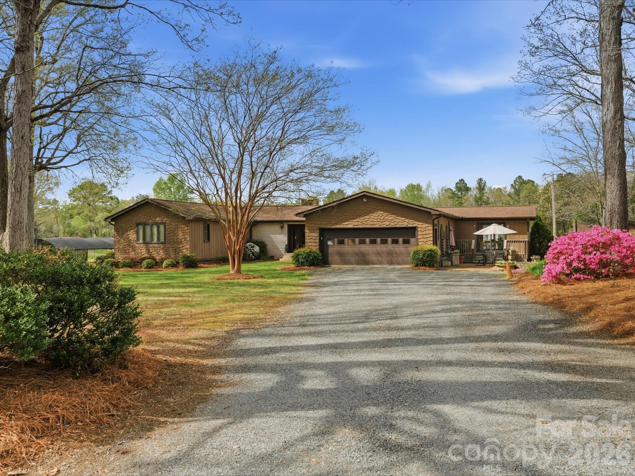 2620 Reeves Island Road Gold Hill, NC 28071 - Photo 2 of 48 a front view of a house with a garden