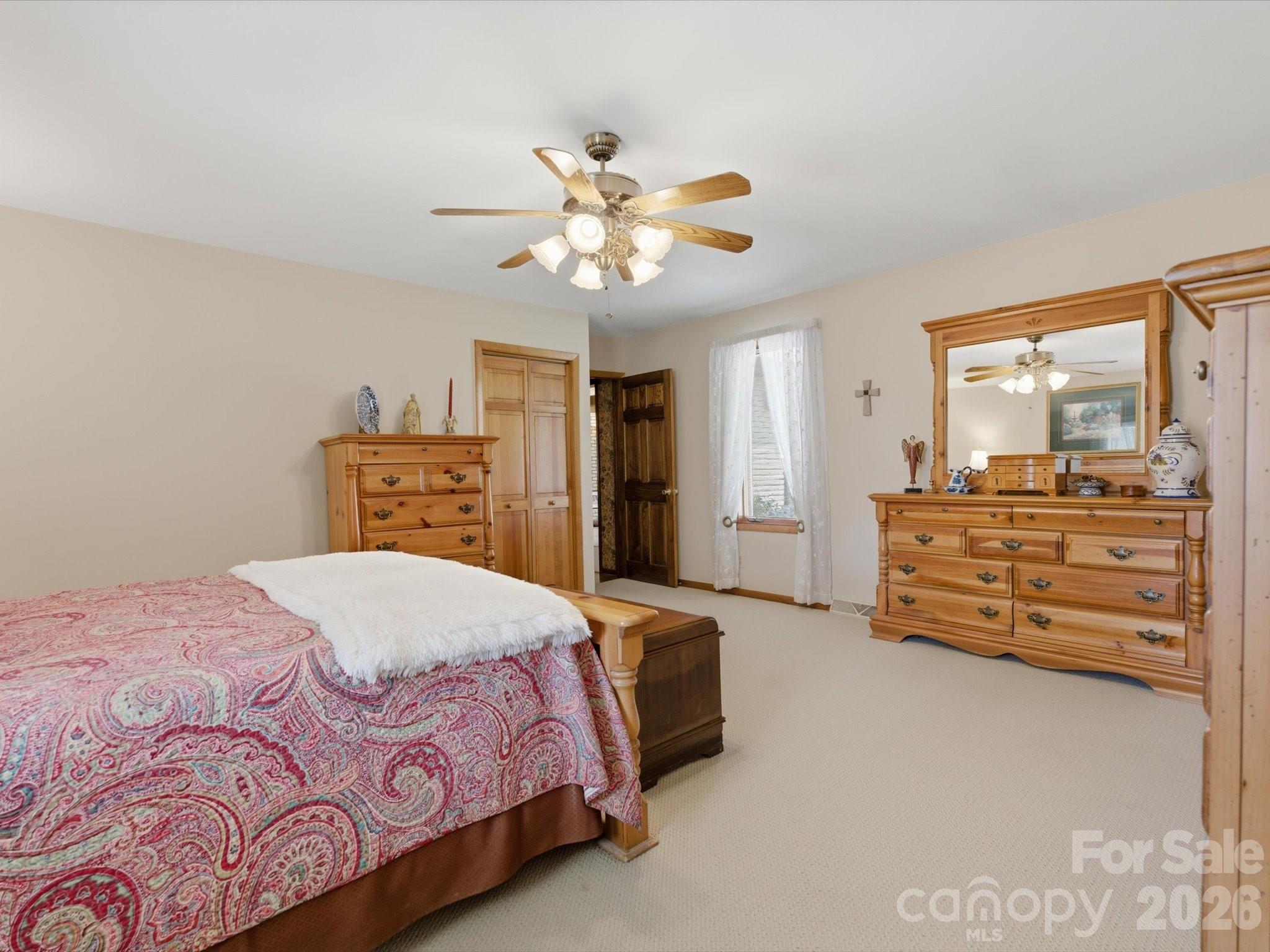 2620 Reeves Island Road Gold Hill, NC 28071 - Photo 24 of 48 a bed room with a bed and a chandelier