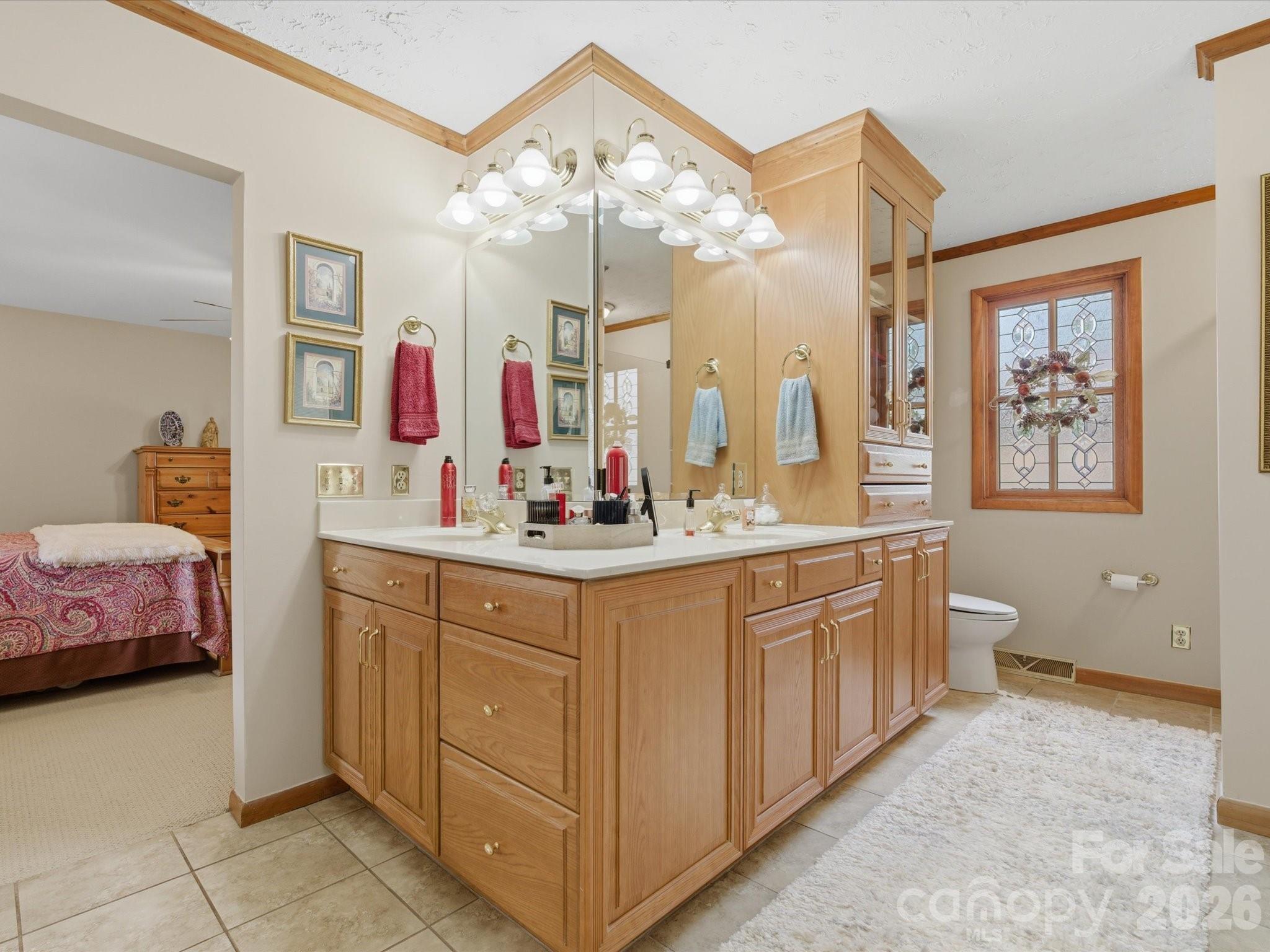 2620 Reeves Island Road Gold Hill, NC 28071 - Photo 25 of 48 a bathroom with a double vanity sink mirror and bathtub