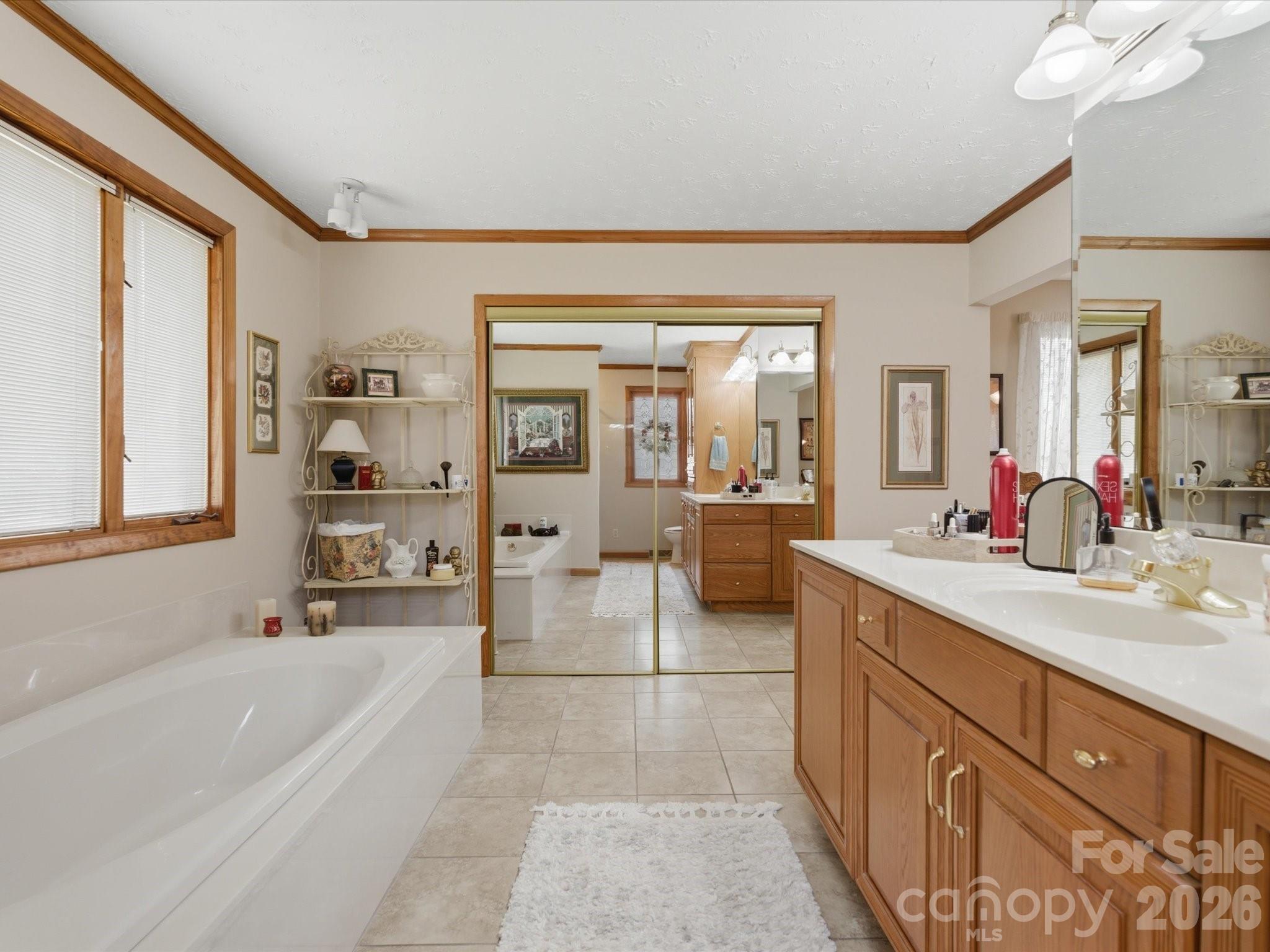 2620 Reeves Island Road Gold Hill, NC 28071 - Photo 27 of 48 a spacious bathroom with a tub sink and mirror