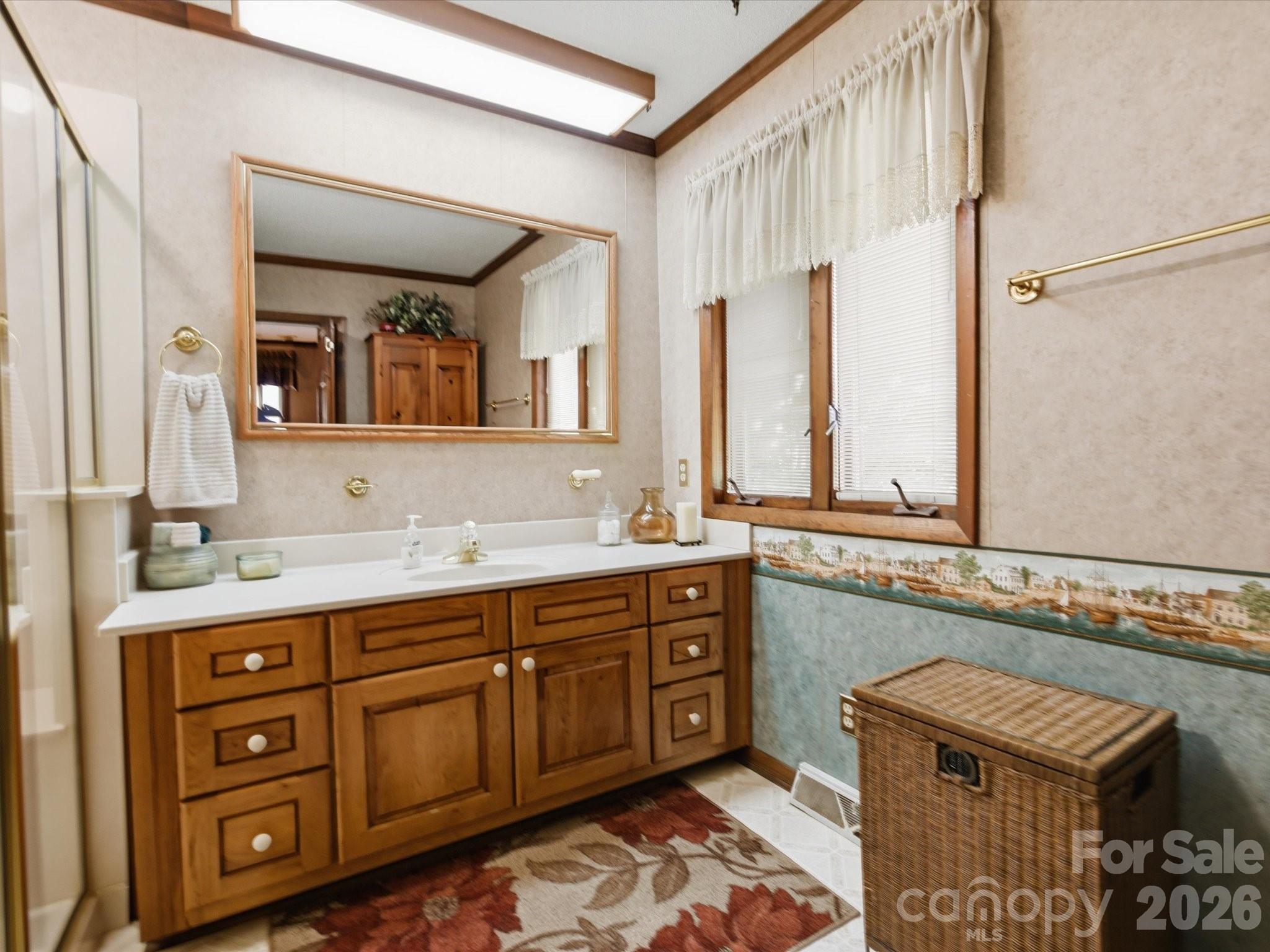 2620 Reeves Island Road Gold Hill, NC 28071 - Photo 29 of 48 a spacious bathroom with a double vanity sink a mirror and a bathtub