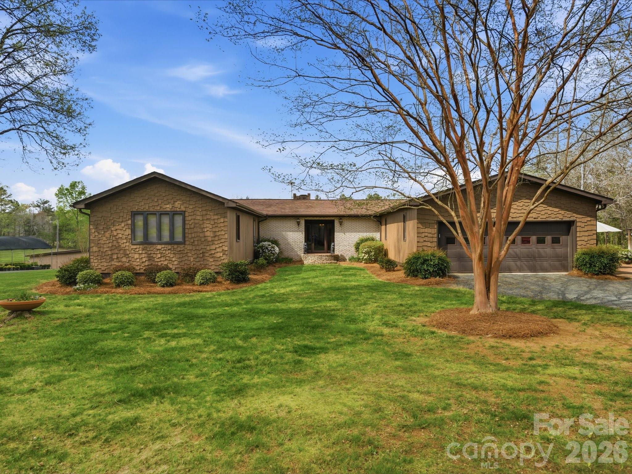 2620 Reeves Island Road Gold Hill, NC 28071 - Photo 3 of 48 a front view of a house with a yard