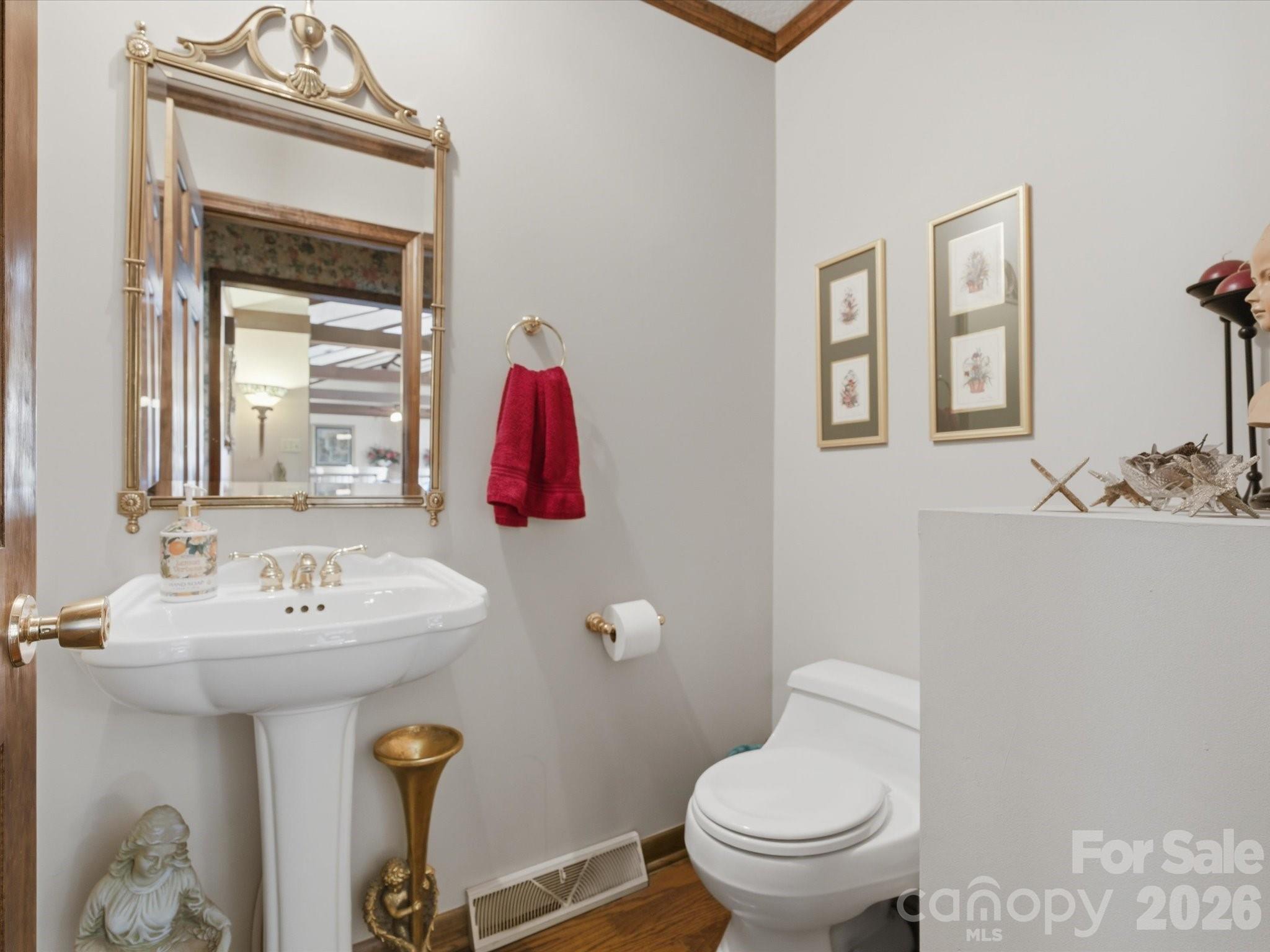 2620 Reeves Island Road Gold Hill, NC 28071 - Photo 31 of 48 a bathroom with a sink mirror and toilet