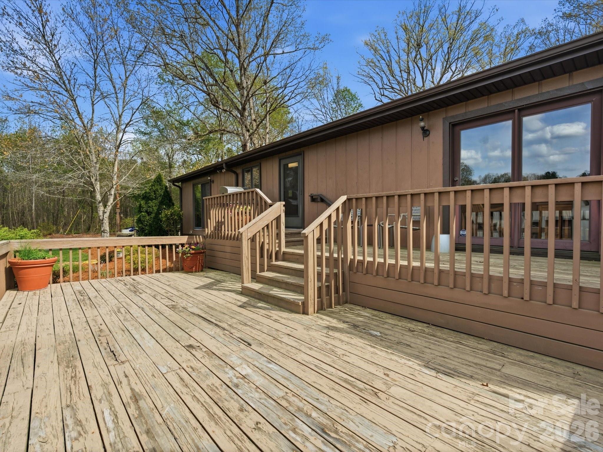 2620 Reeves Island Road Gold Hill, NC 28071 - Photo 33 of 48 a view of deck with wooden floor and fence with a large garden