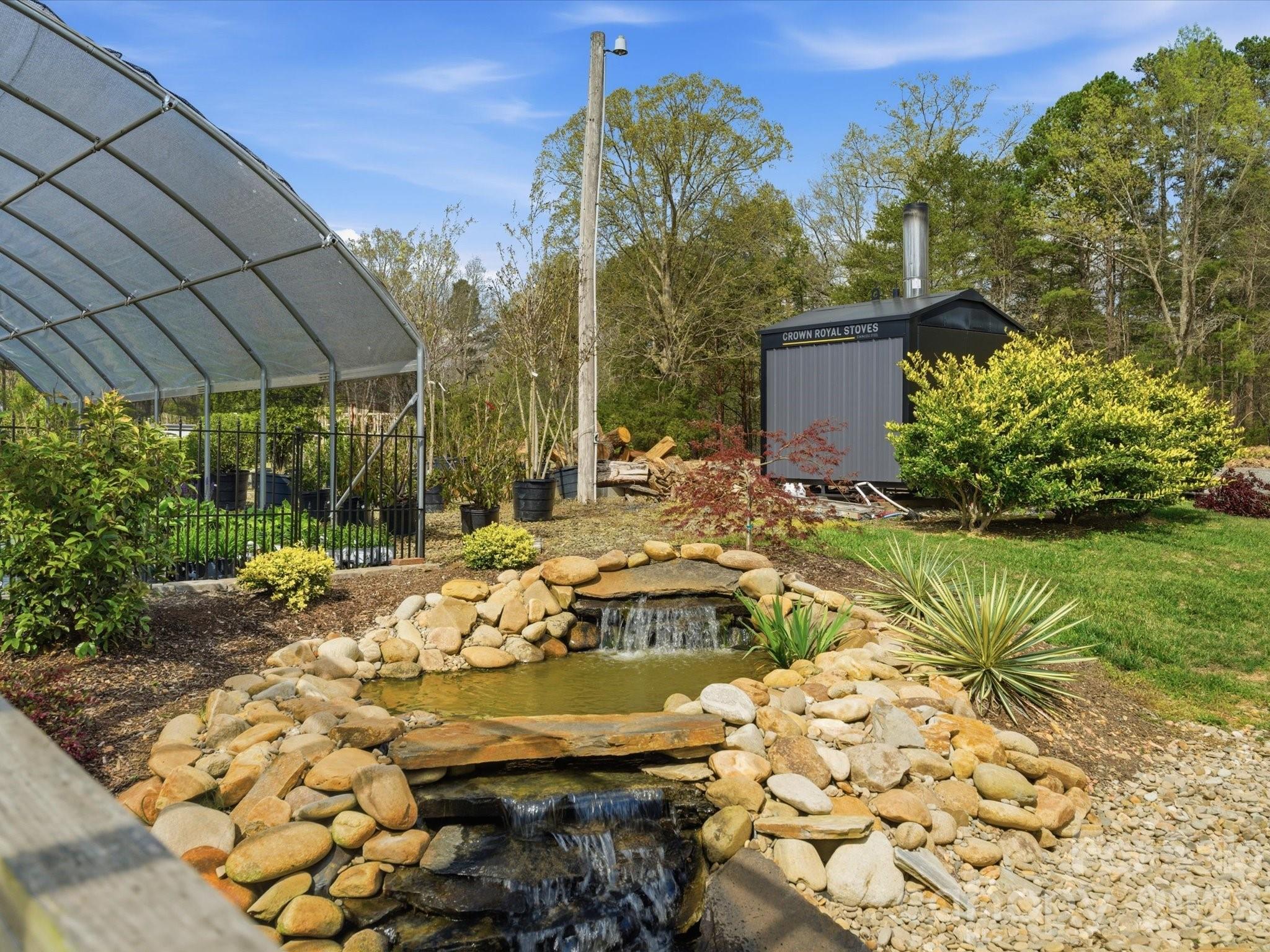 2620 Reeves Island Road Gold Hill, NC 28071 - Photo 40 of 48 a view of a backyard with plants and patio