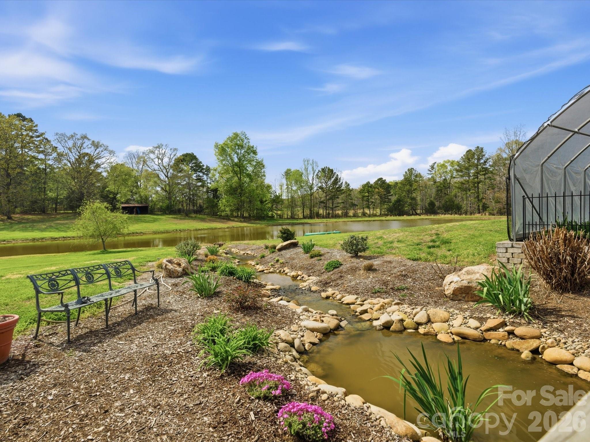 2620 Reeves Island Road Gold Hill, NC 28071 - Photo 41 of 48 a view of a lake with a yard