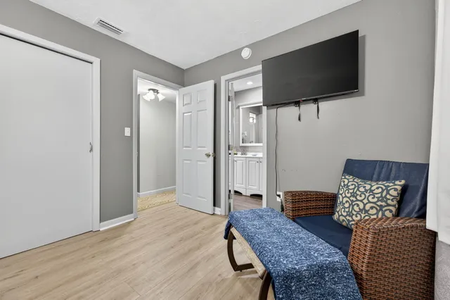 a living room with furniture fireplace and a flat screen tv