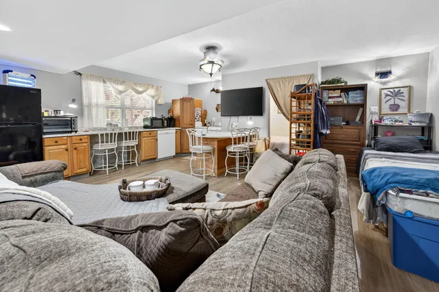 a bedroom with a bed and a tv