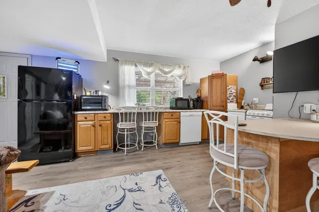 a bathroom with a toilet a sink and a mirror