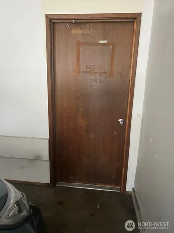 a view of staircase with white walls