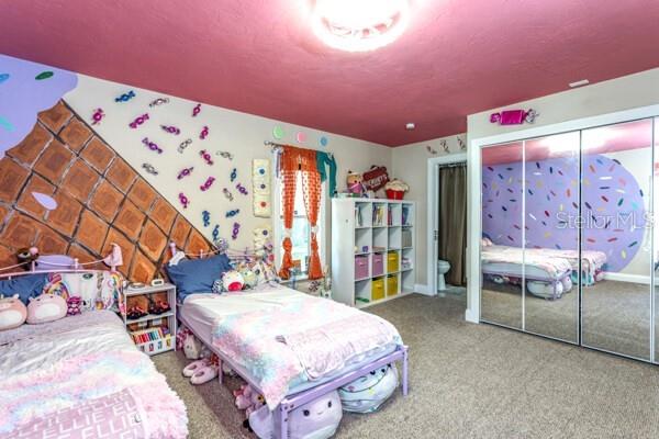 504 North Cherry Street Bunnell, FL 32110 - Photo 21 of 40 a spacious bedroom with a bed and a dresser in it