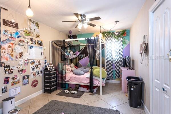 504 North Cherry Street Bunnell, FL 32110 - Photo 23 of 40 en bedroom with furniture and a chandelier