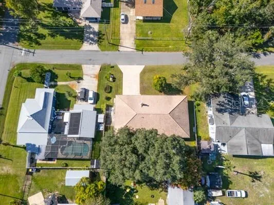 an aerial view of residential houses with outdoor space