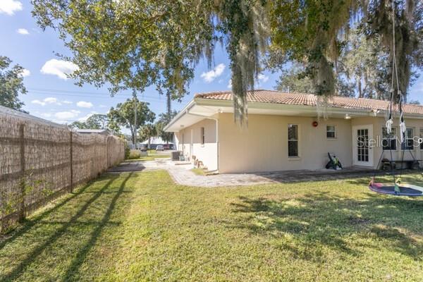 504 North Cherry Street Bunnell, FL 32110 - Photo 34 of 40 a view of a house with backyard and tree