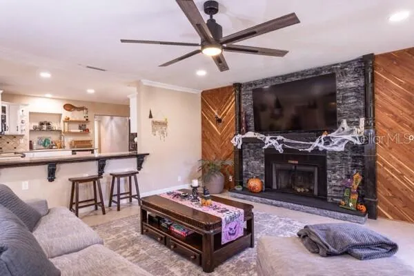 a living room with furniture and a flat screen tv