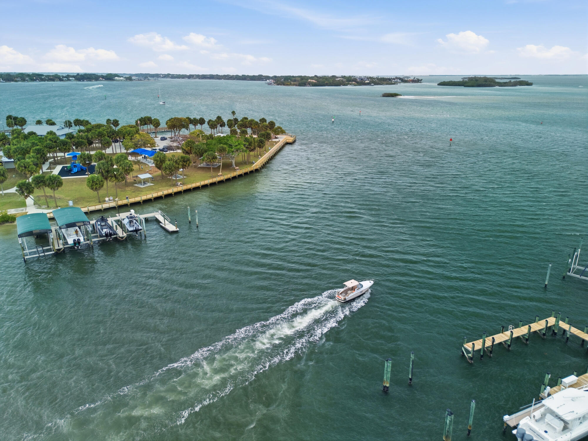 3832 Jefferson Street Stuart, FL 34997 - Photo 24 of 25 a view of a lake with lawn chairs