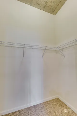 a bathroom with a toilet a sink and shower