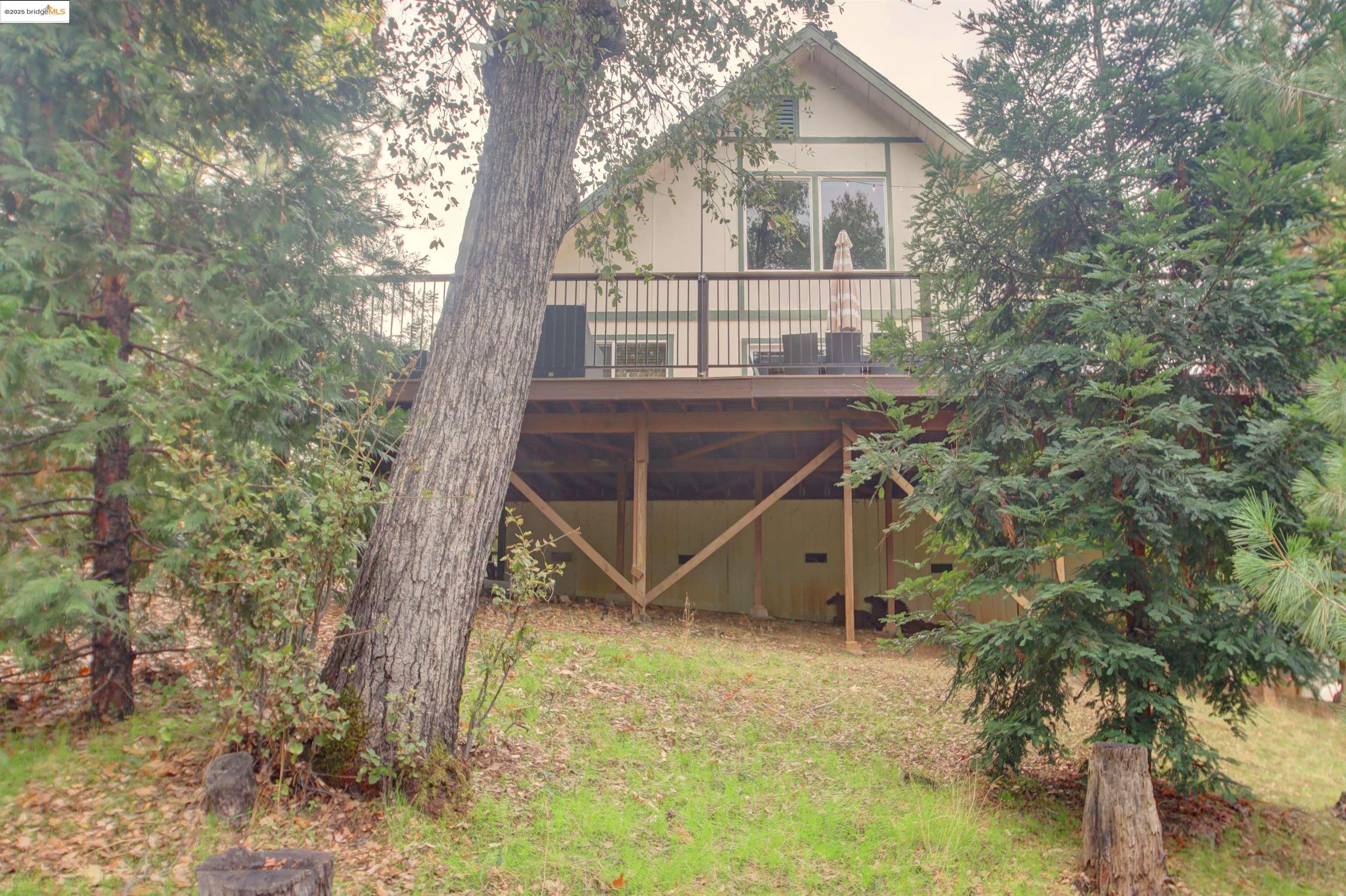 a view of house with a trees