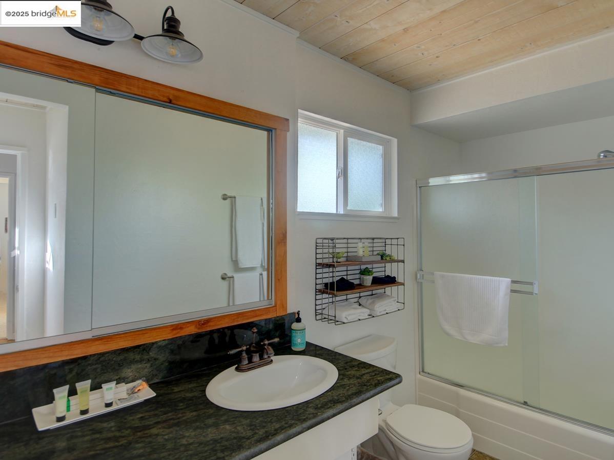 11979 Myer Court Groveland, CA 95321 - Photo 24 of 39 a bathroom with a sink toilet a mirror and shower