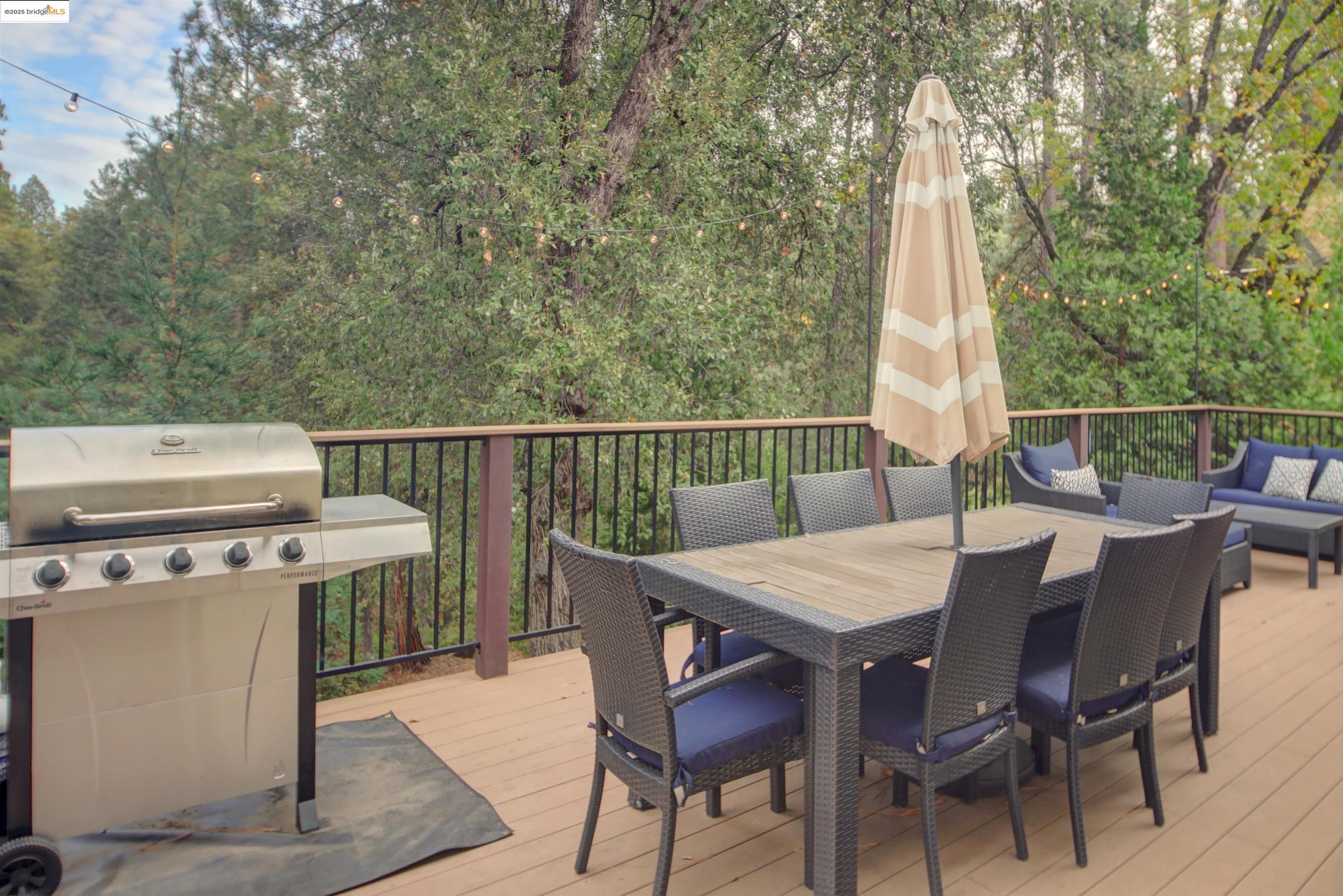 11979 Myer Court Groveland, CA 95321 - Photo 7 of 39 a view of a dinning table and chairs in the roof deck