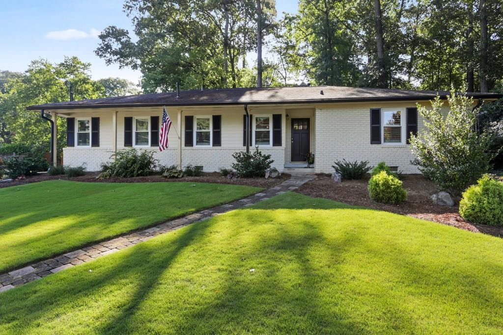 a view of a house with a yard patio and a patio