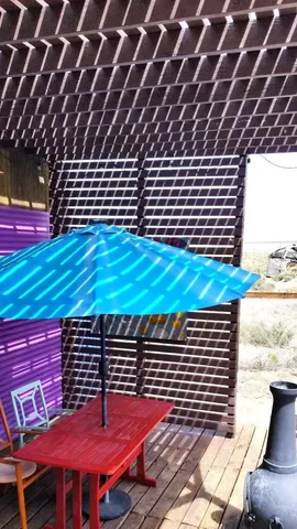 a bedroom with furniture and a floor to ceiling window