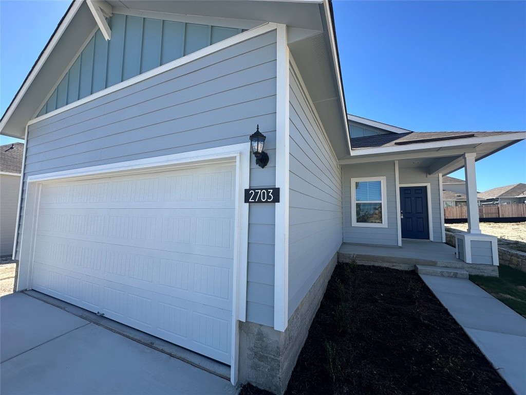 a view of a house with a barbeque