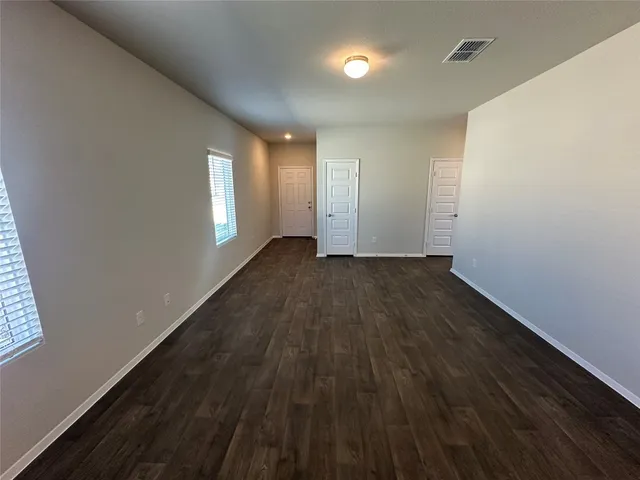 a view of an empty room and window