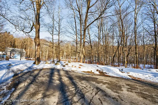 a view of snow on the side of a road