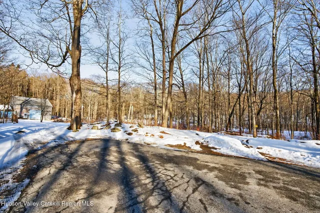 a view of snow on the side of a road