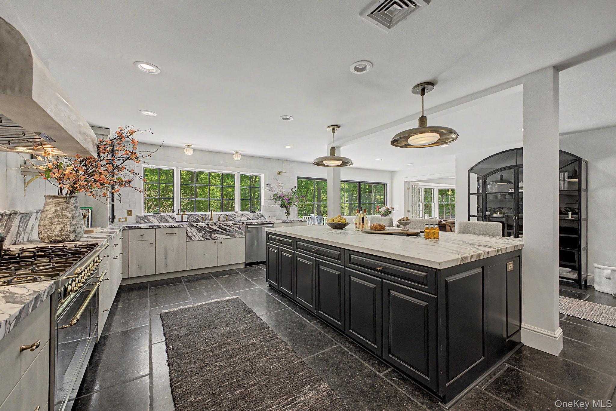 240 Eastwoods Road Pound Ridge, NY 10576 - Photo 9 of 13 a kitchen with stainless steel appliances granite countertop a stove and a sink