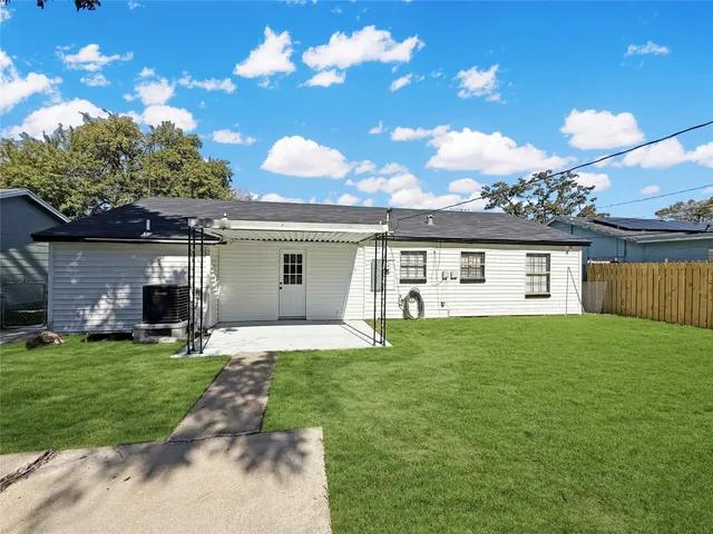 a view of a yard with a house and a garden
