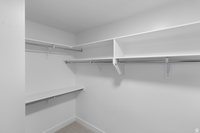 2840 West Aurora Avenue Mapleton, UT 84664 - Photo 10 of 14 Built-in shelving with hanging rods and carpet flooring