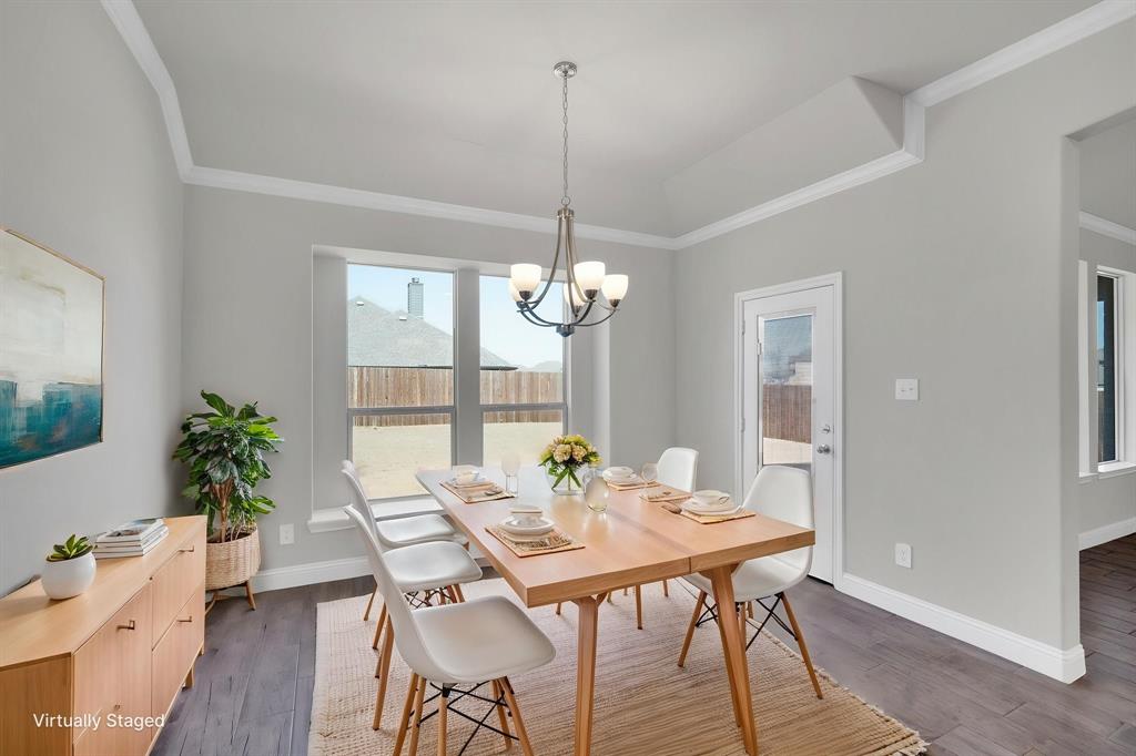 395 Haven Road Waxahachie, TX 75165 - Photo 12 of 40 a view of a dining room with furniture window and wooden floor