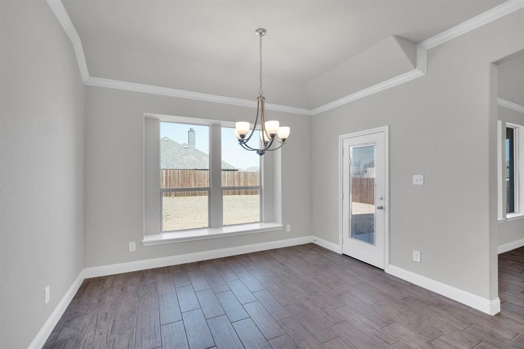 395 Haven Road Waxahachie, TX 75165 - Photo 13 of 40 a view of empty room with wooden floor and fan